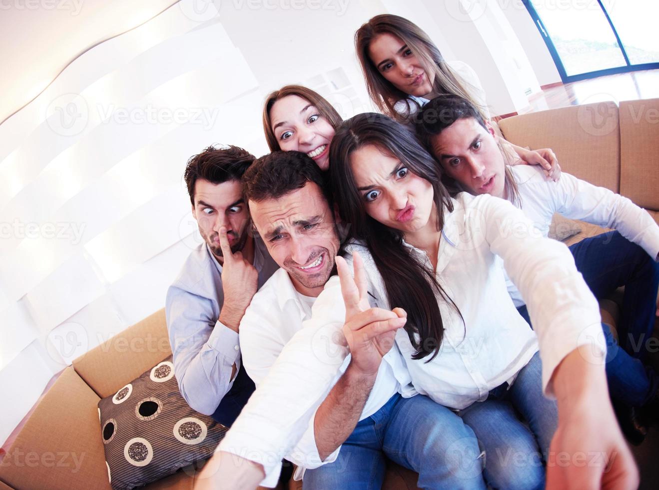 group of friends taking selfie photo