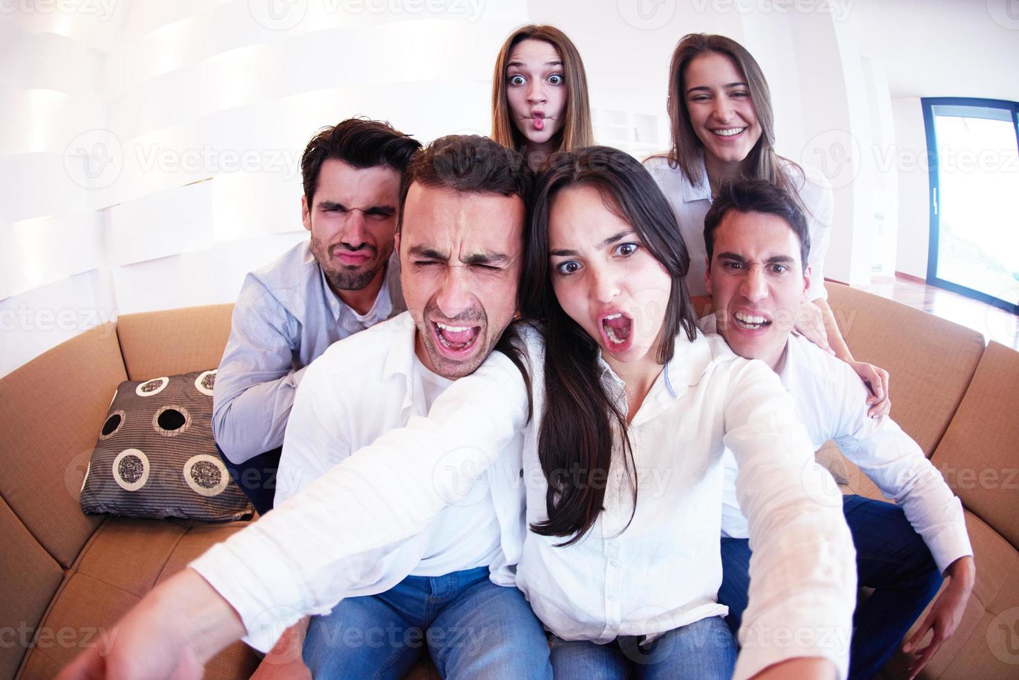 group of friends taking selfie photo