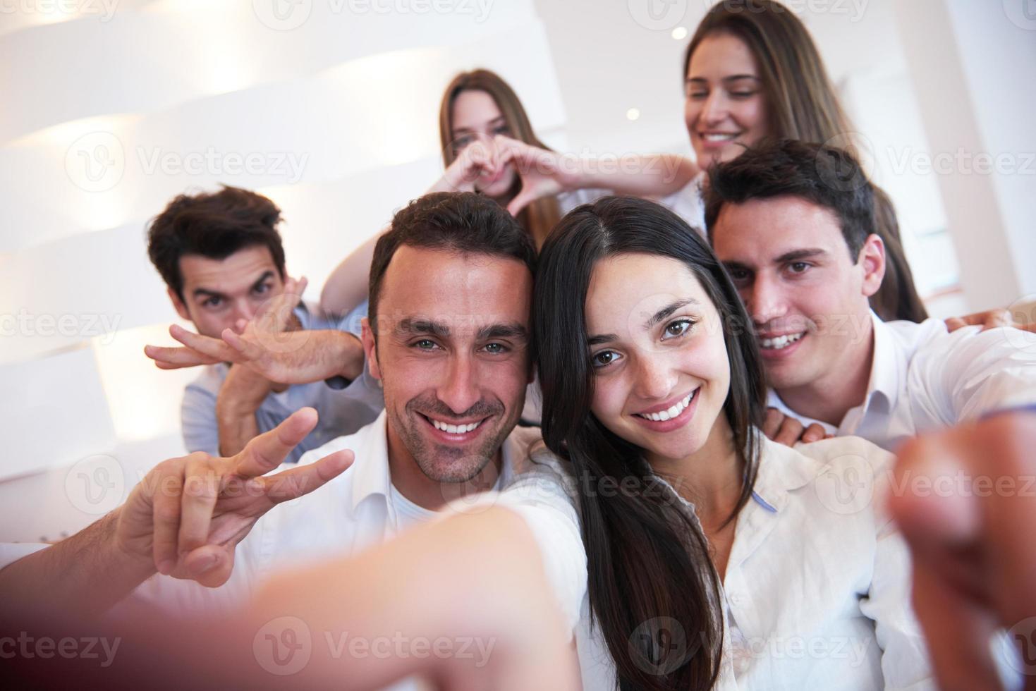 group of friends taking selfie photo