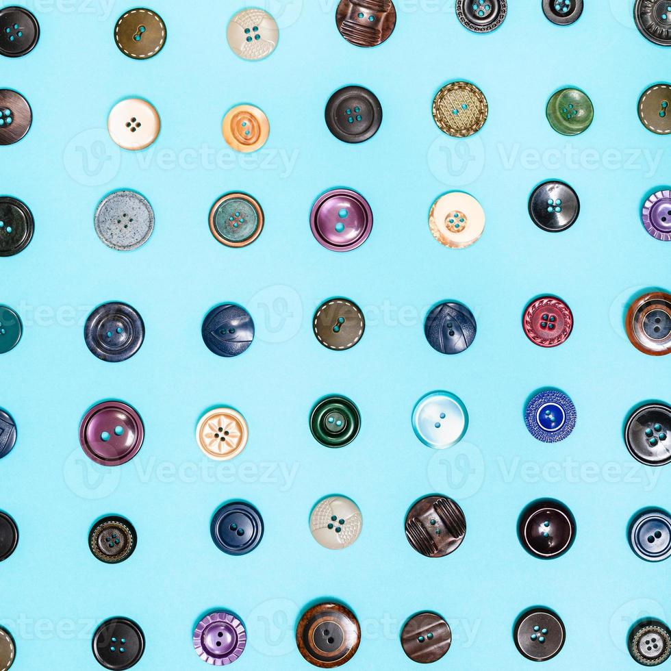 many different buttons arranged on blue background photo