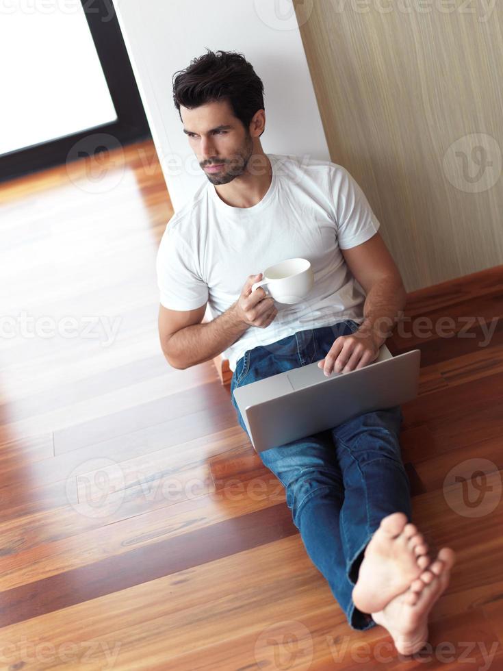 working on laptop computer from home photo