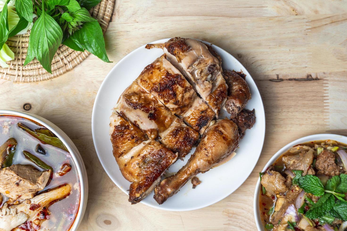 Top view Thai-Isan food on wooden table. photo