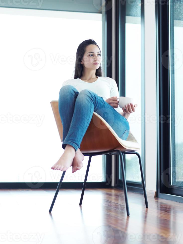 beautiful young woman drink first morning coffee photo