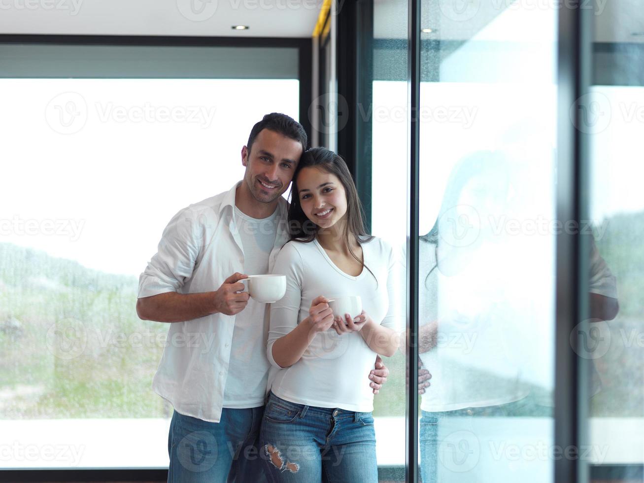 relaxet young couple drink first morning coffee photo