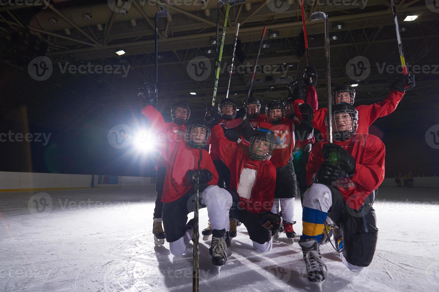 happy children gropu  hockey team sport players photo
