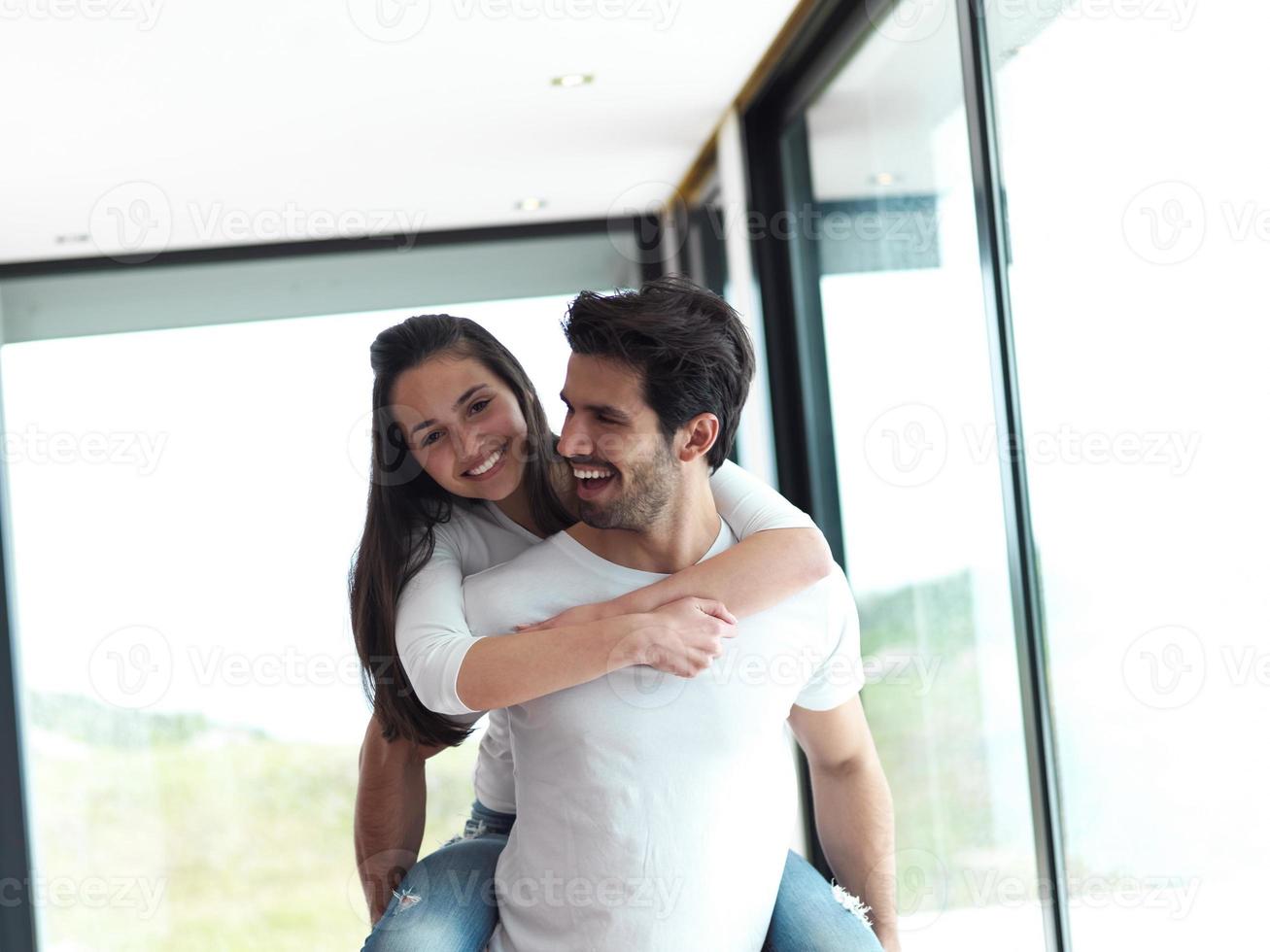 happy young romantic couple have fun and  relax at home indoors photo