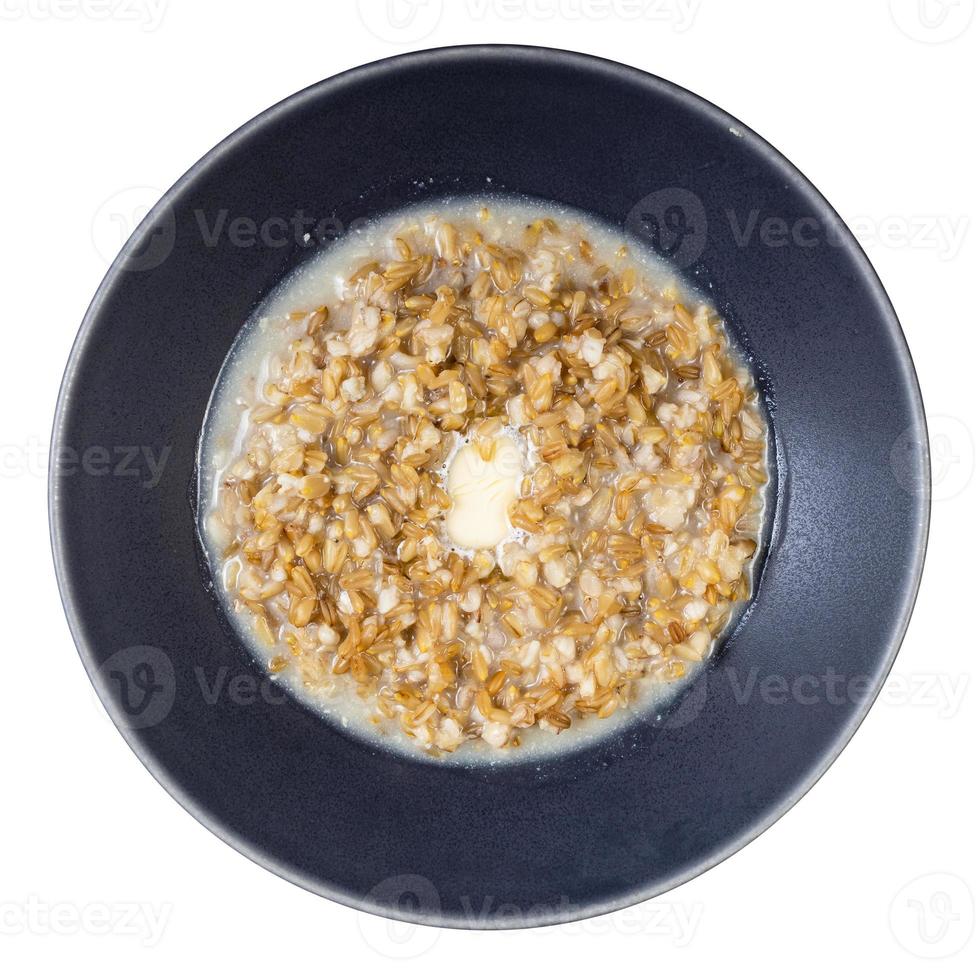 buttered porridge from wholegrain oat in gray bowl photo