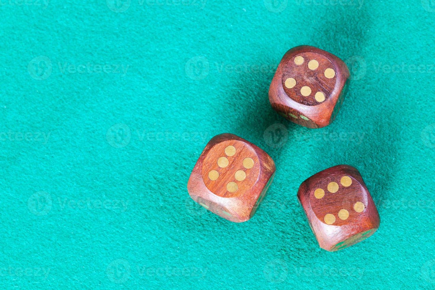 top view of three wooden dices with six points photo