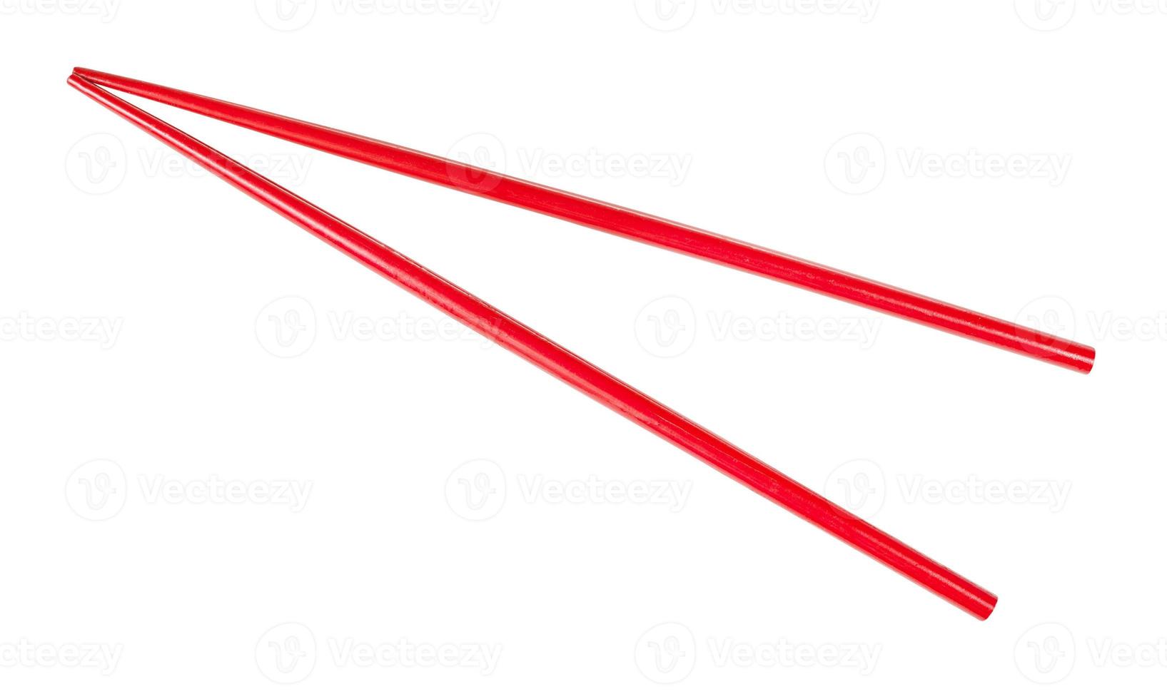 red painted wooden chopsticks isolated photo