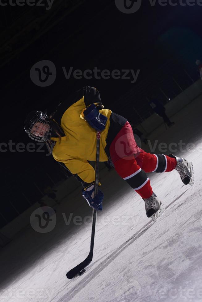 teen ice hockey player in action photo