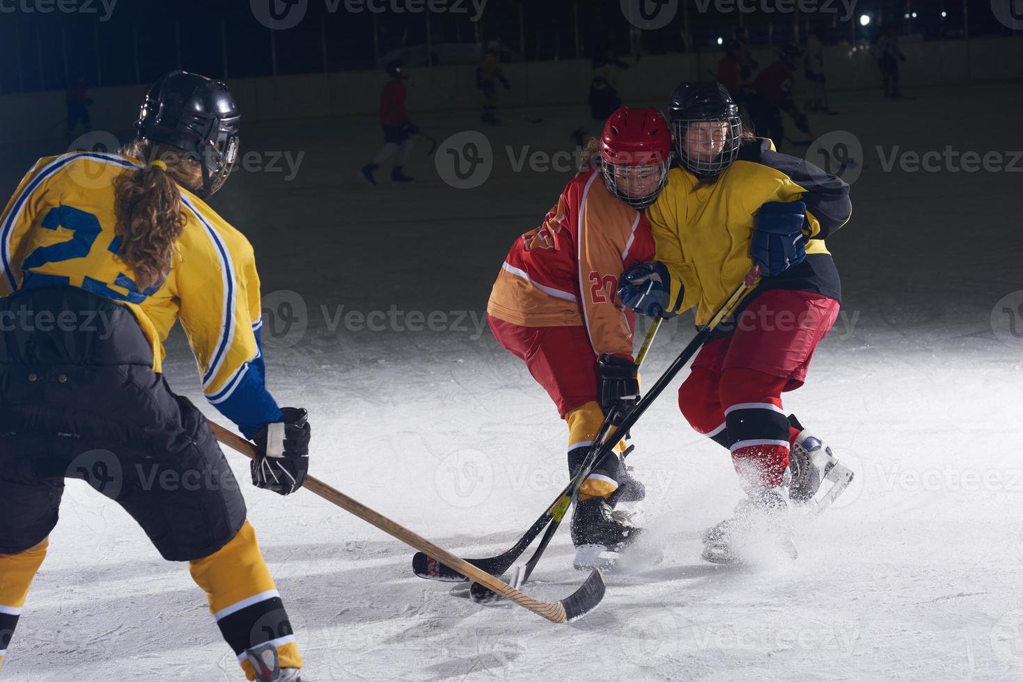 teen ice hockey sport  players in action photo