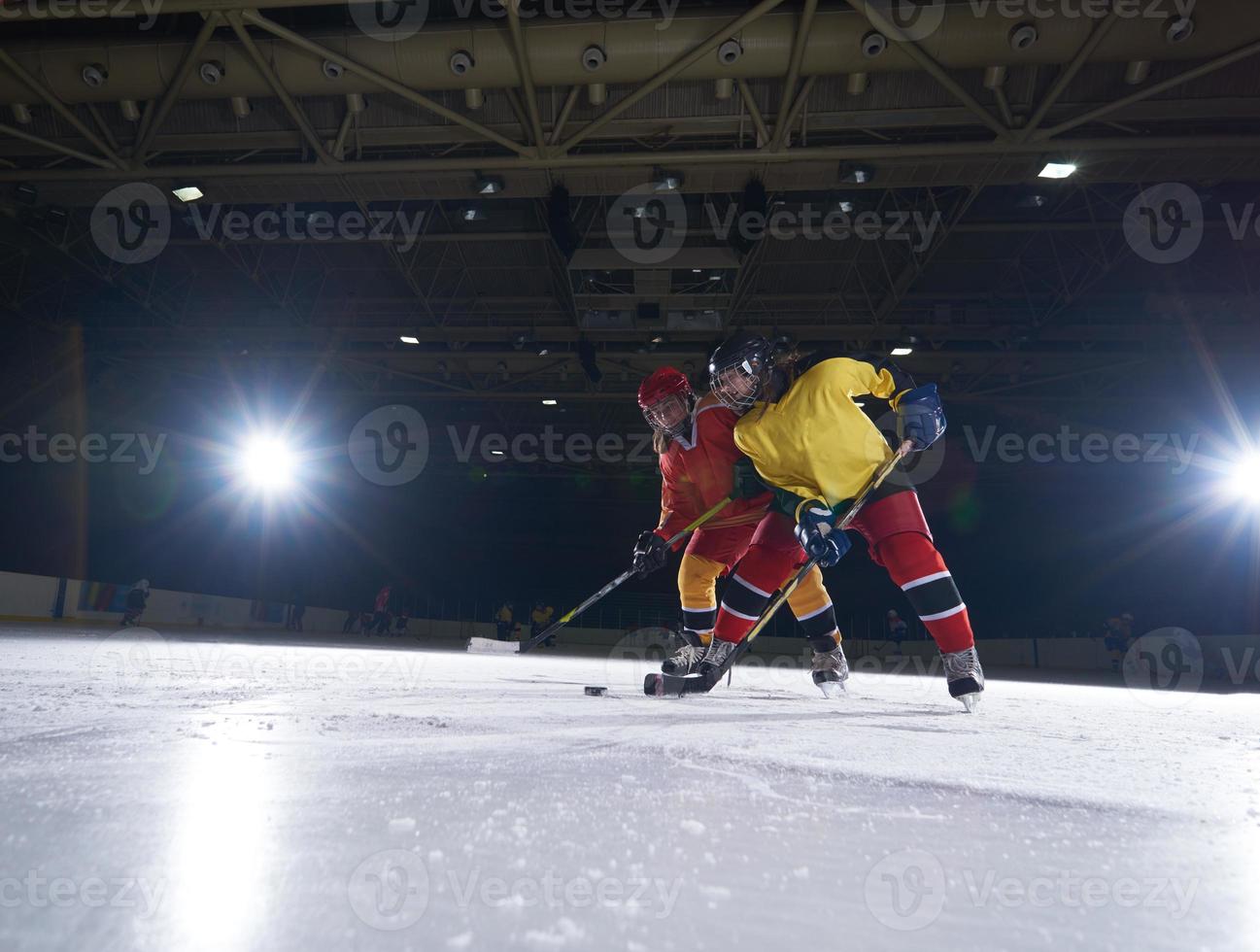 teen ice hockey sport  players in action photo