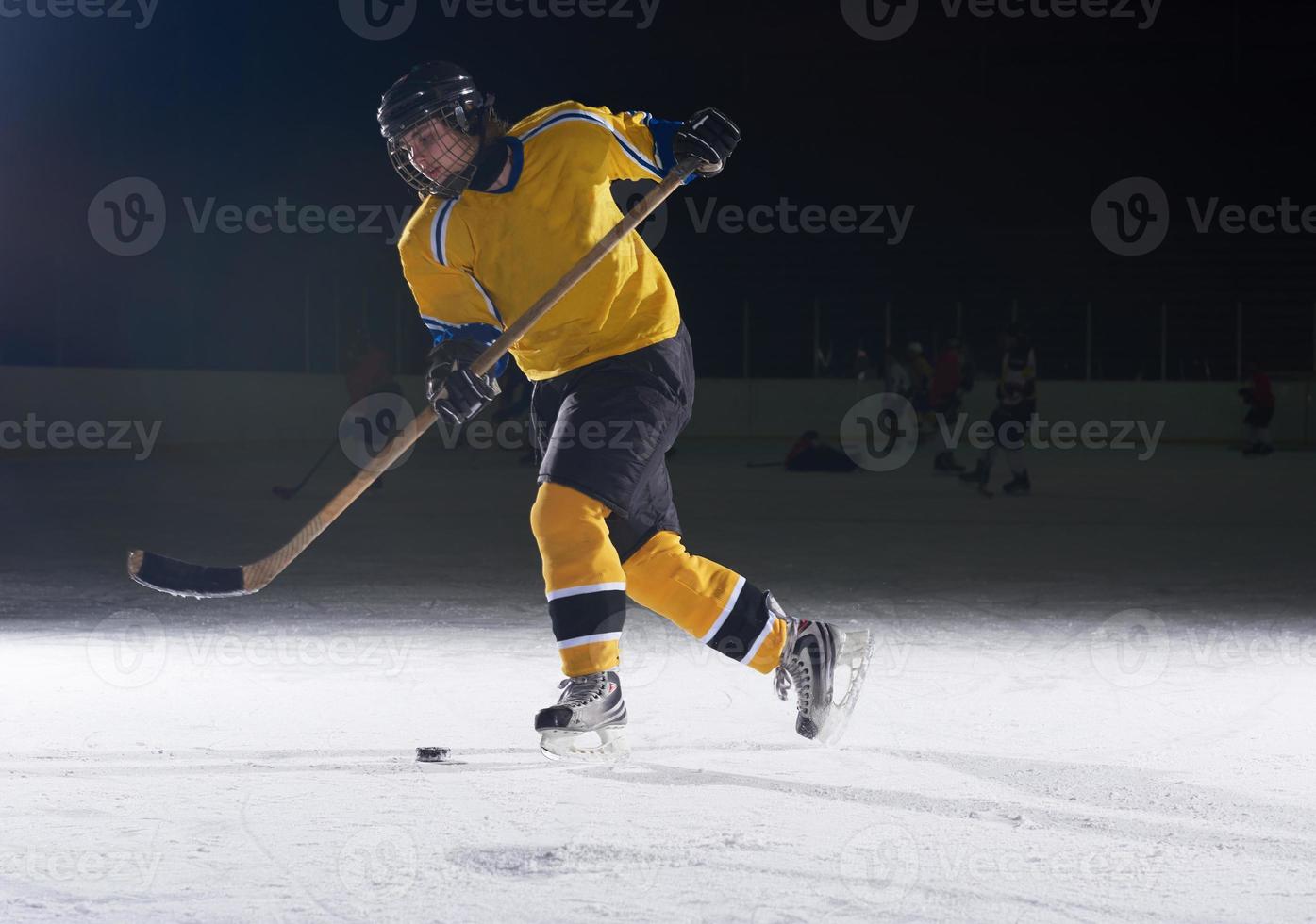 teen ice hockey player in action photo