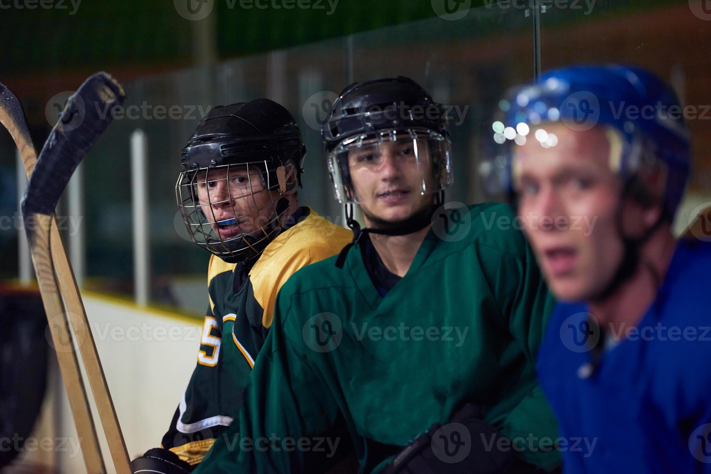 ice hockey players on bench 10832916 Stock Photo at Vecteezy