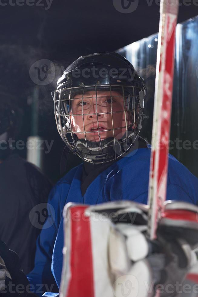 ice hockey players on bench photo