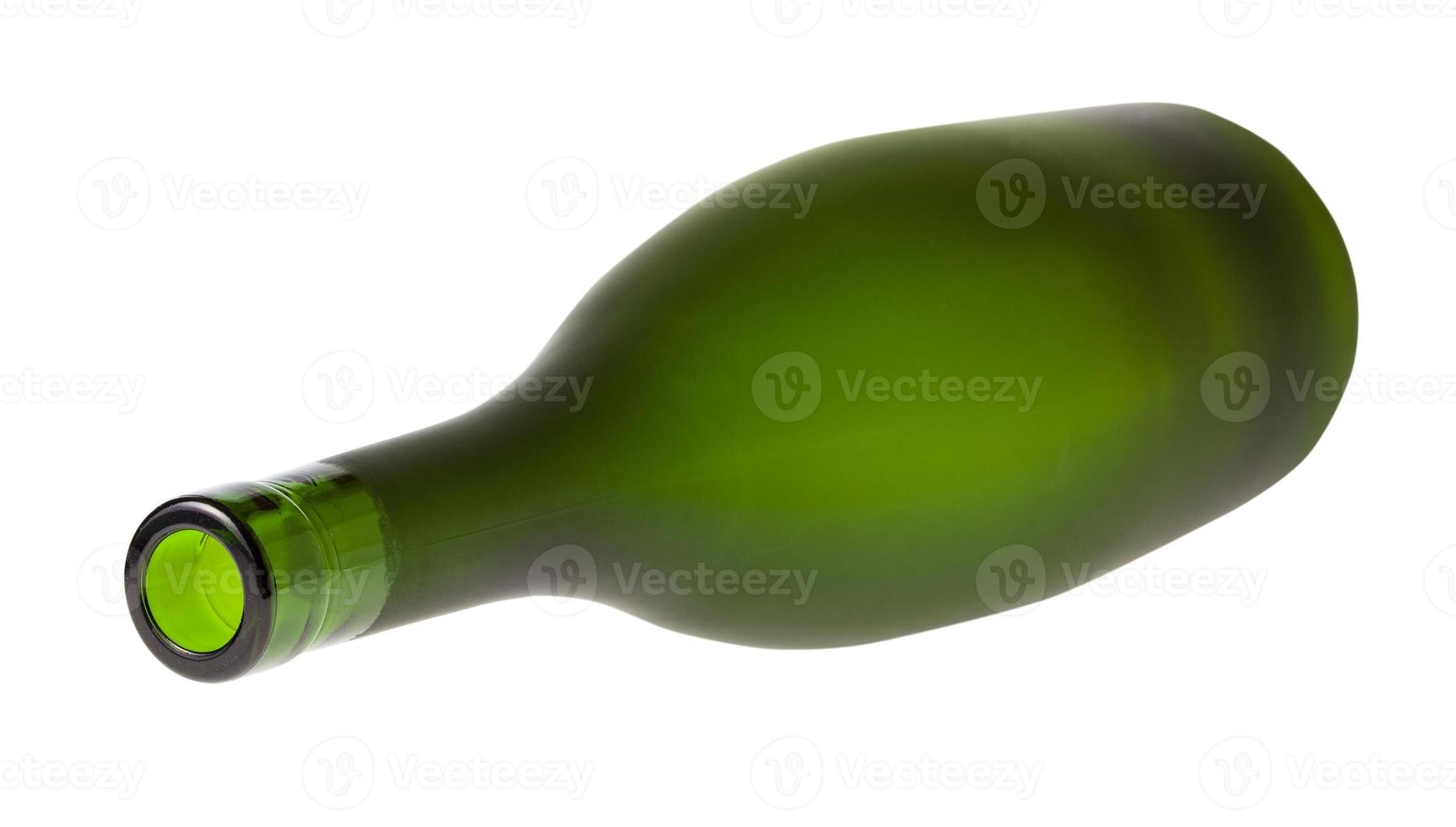 lying empty green brandy bottle isolated on white photo