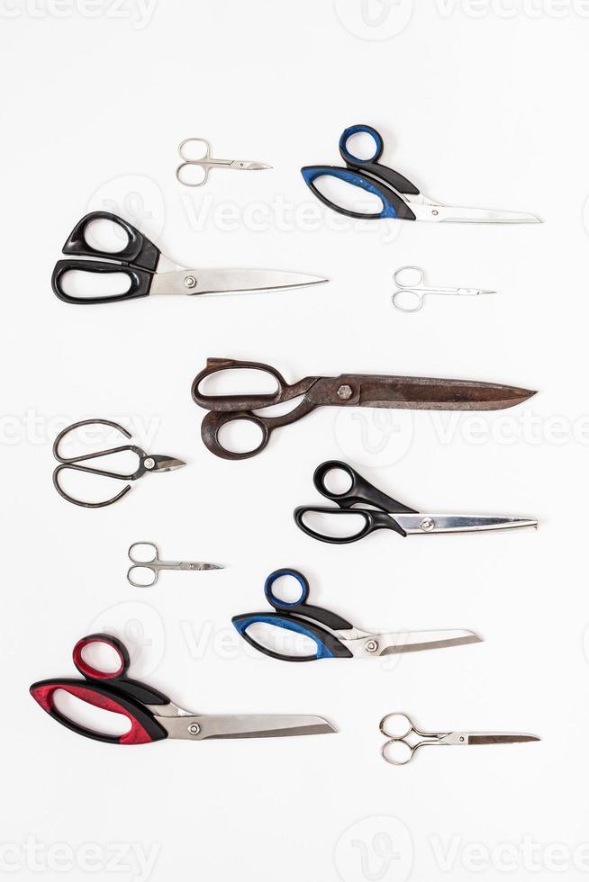 vertical pattern from various scissors on white photo