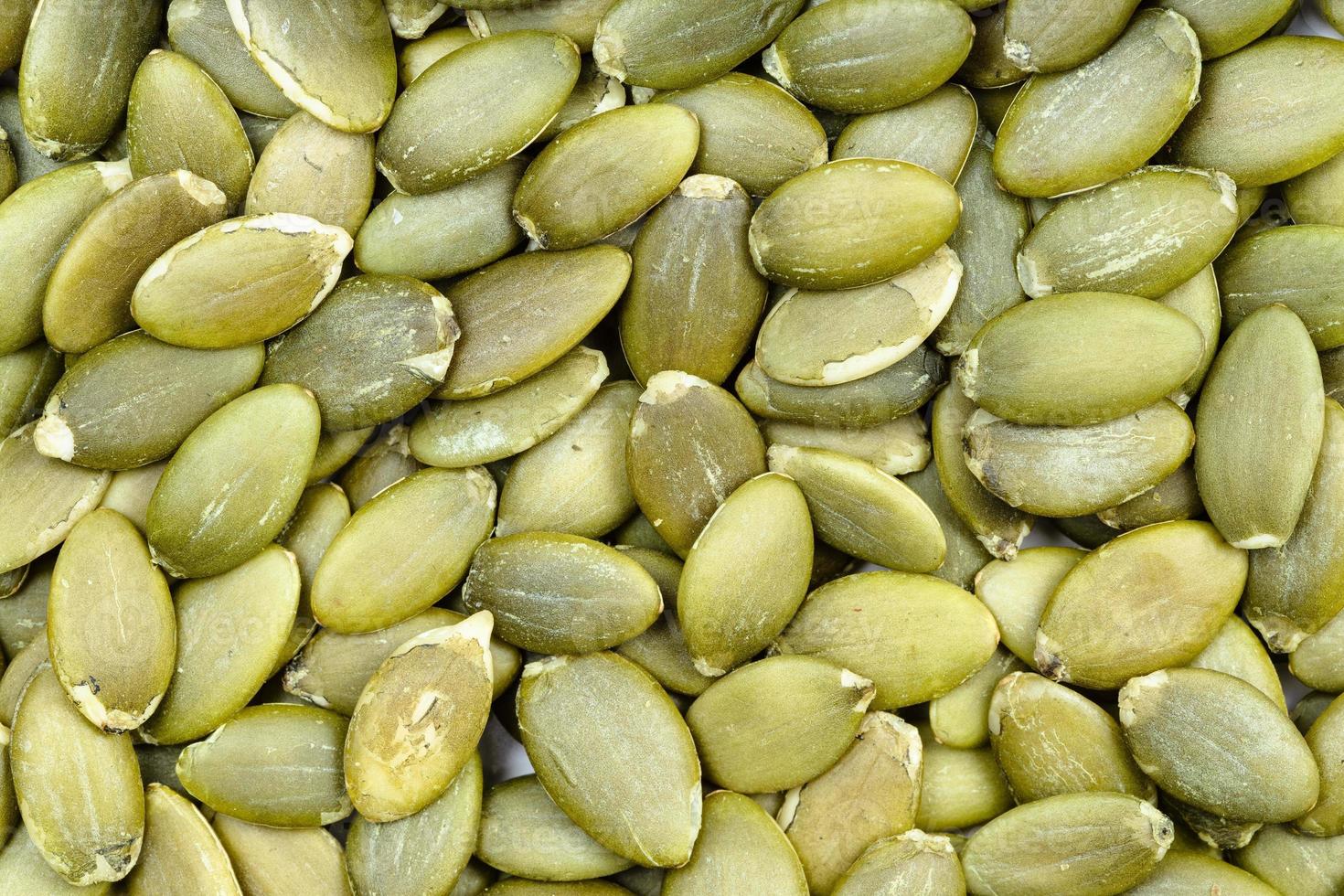 fondo - muchas semillas de calabaza sin cáscara foto