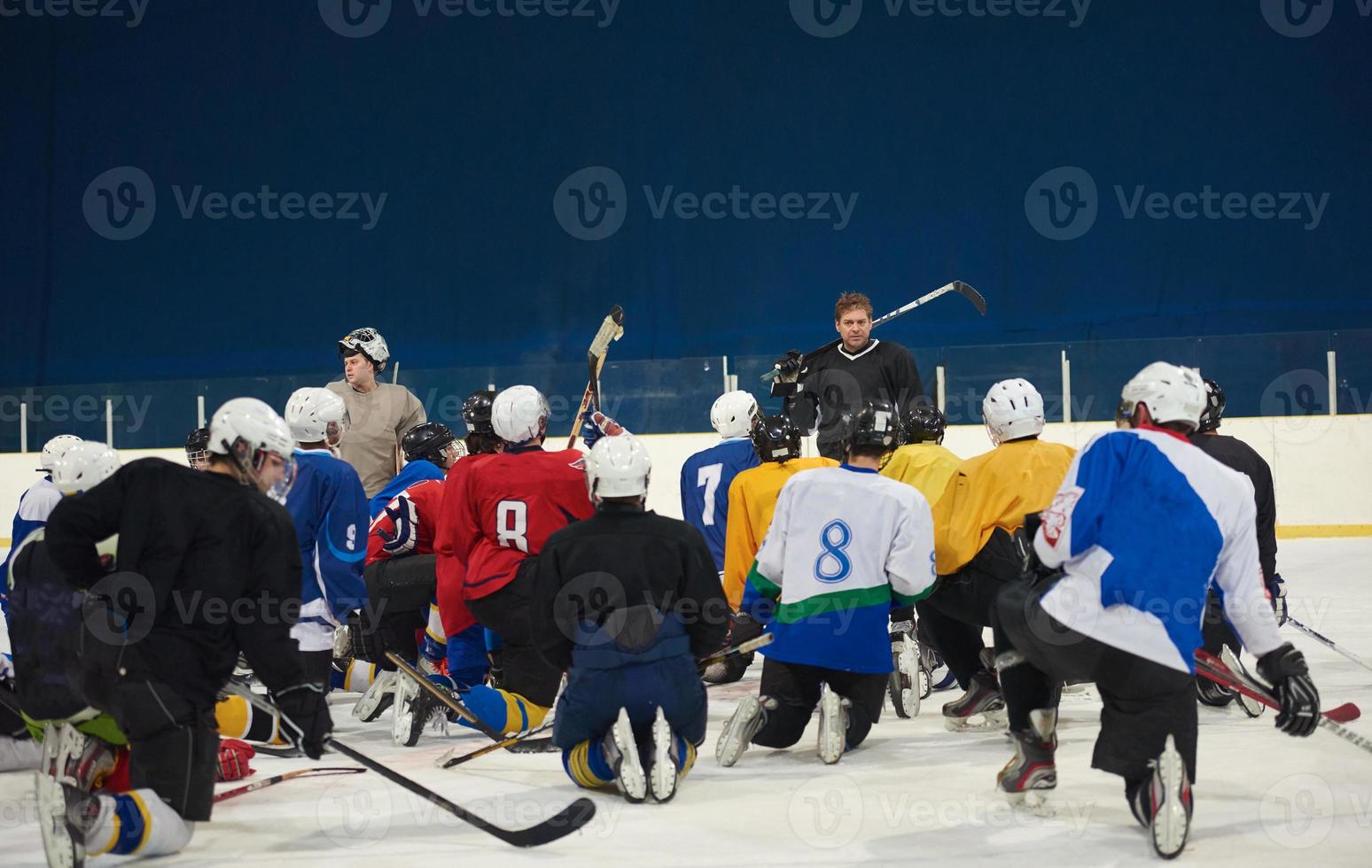 ice hockey players team meeting with trainer photo