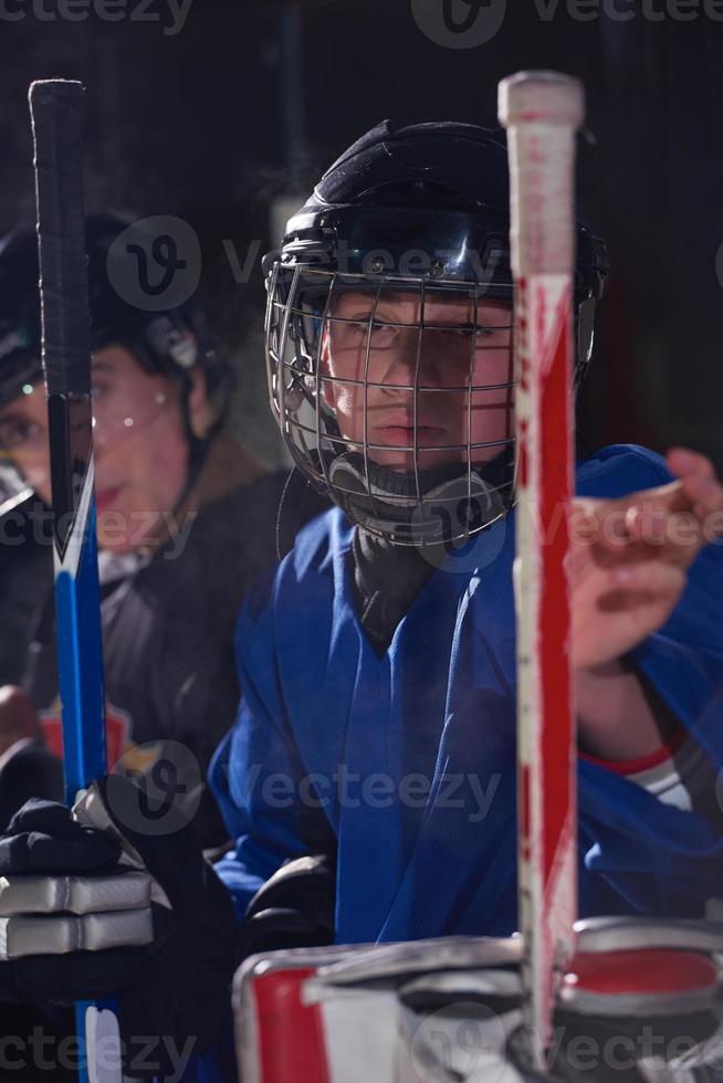 ice hockey players on bench photo