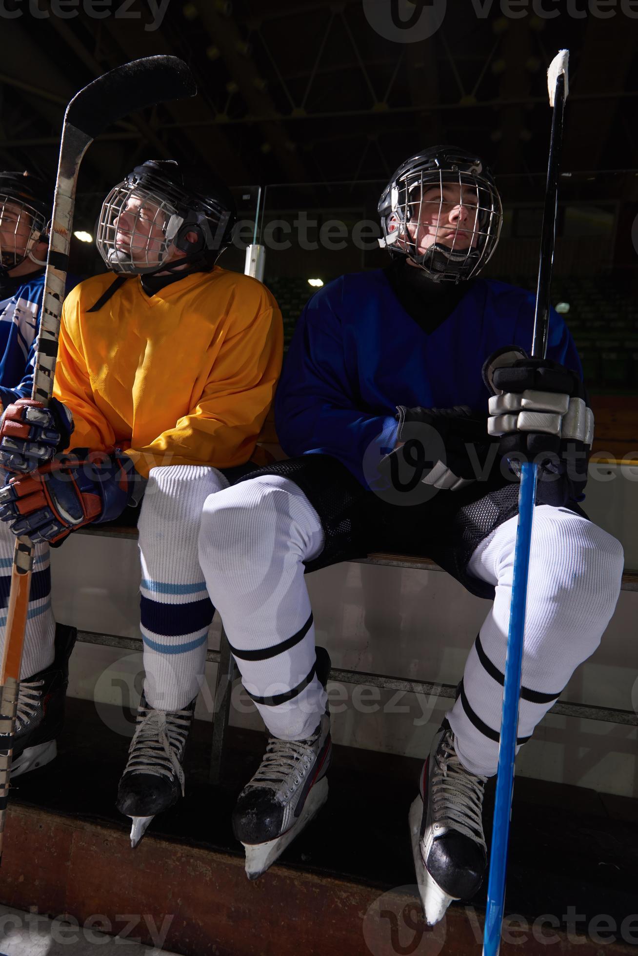 ice hockey players on bench 10836282 Stock Photo at Vecteezy