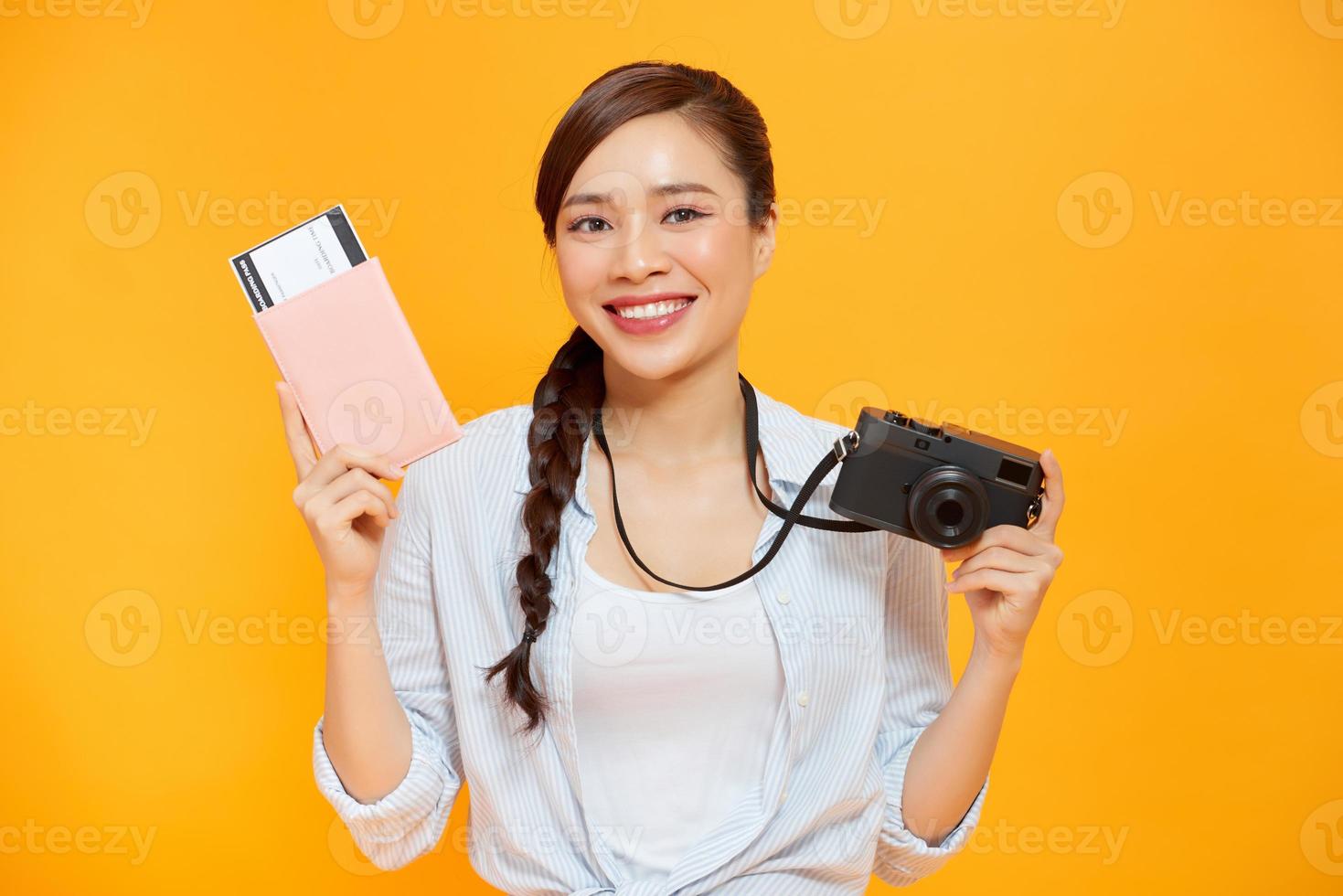 Woman traveler holding passport with ticket photo