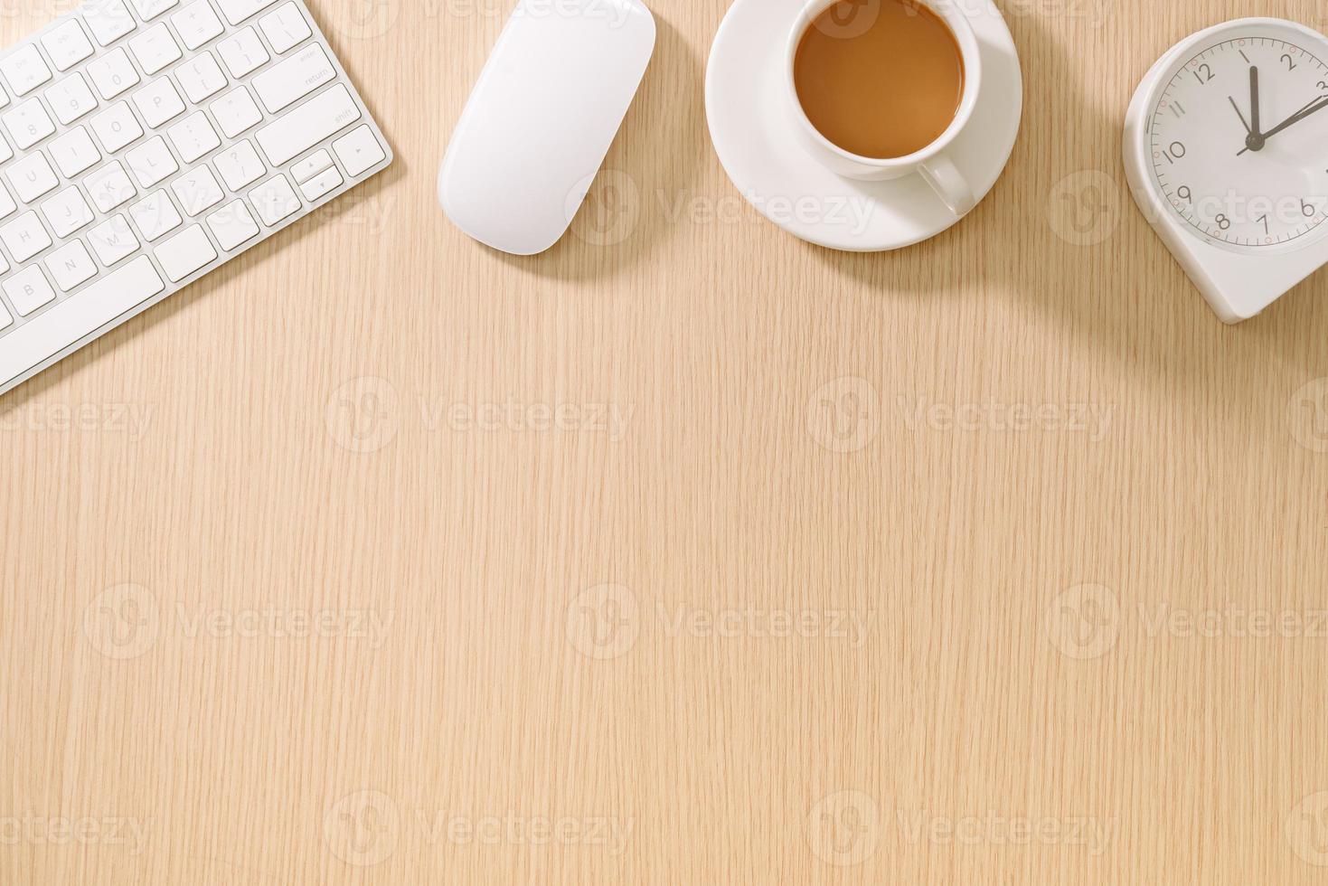 Modern white office desk with keyboard, mouse, oclock and cup of coffee.Top view with copy paste. Business and strategy concept mockup. photo