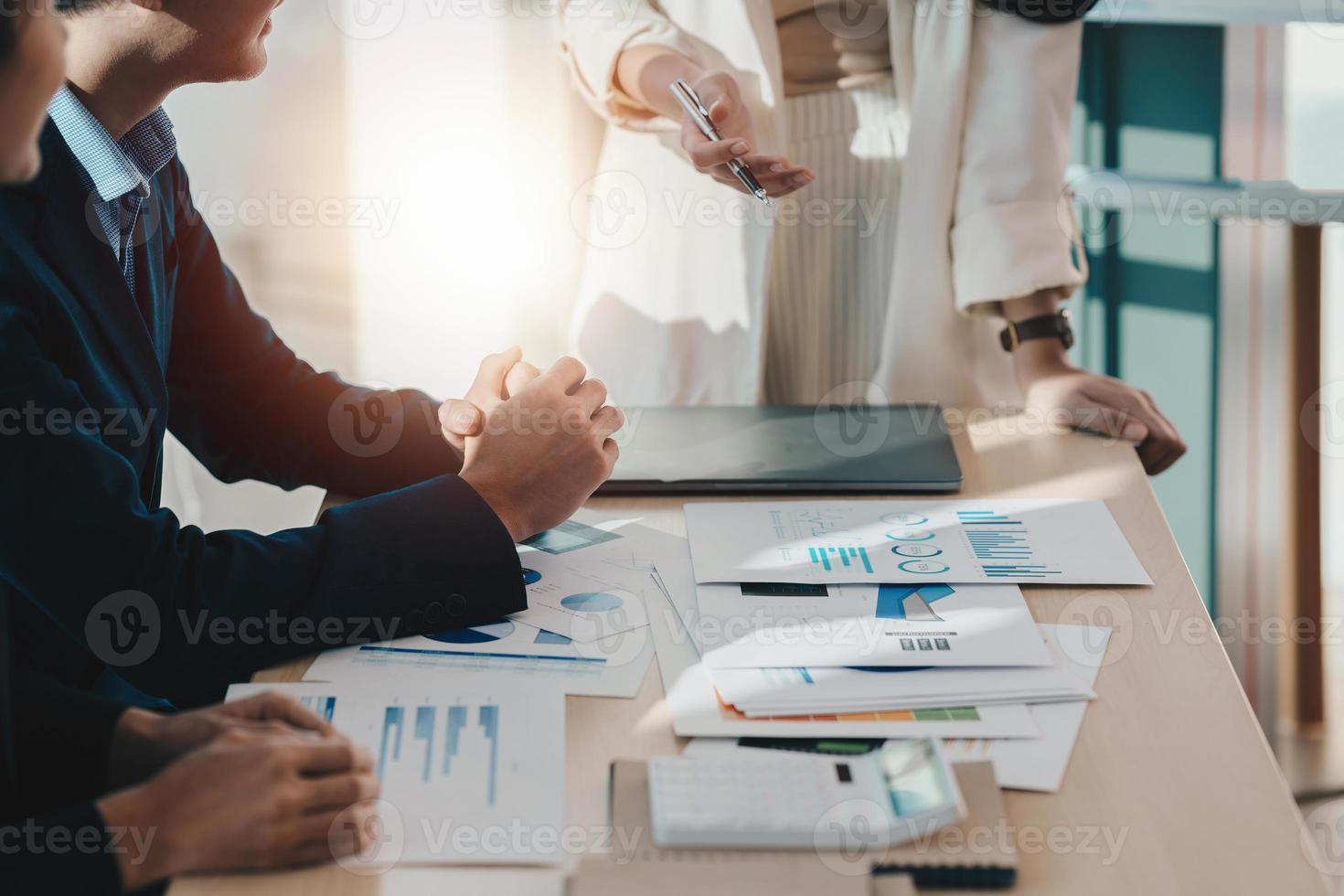 Administration or Accountant discussing with partner are meeting to audit finance planning sales to meet targets set in next year. Finance concept. photo