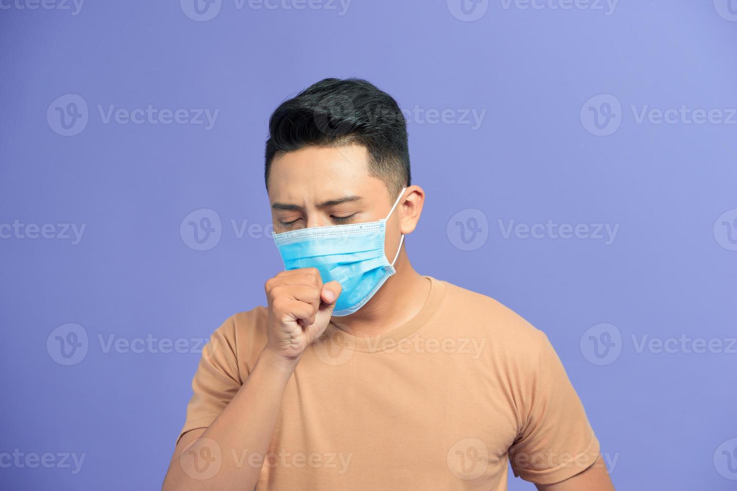 Asian man wearing a face mask with coughing photo