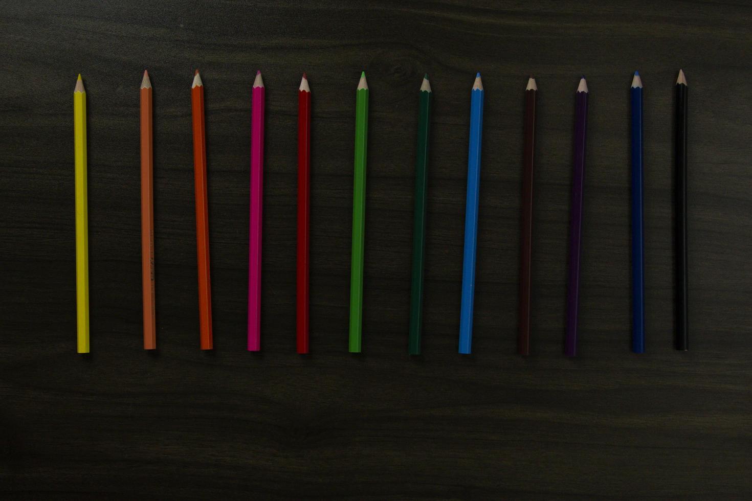 Colored pencils on blue background. with copy spacing photo