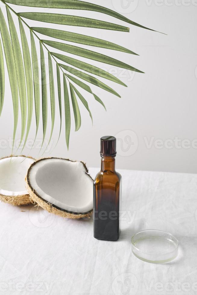 Spa cosmetics in brown glass bottles on gray concrete table. Copy space. Beauty blogger, salon therapy, minimalism concept photo