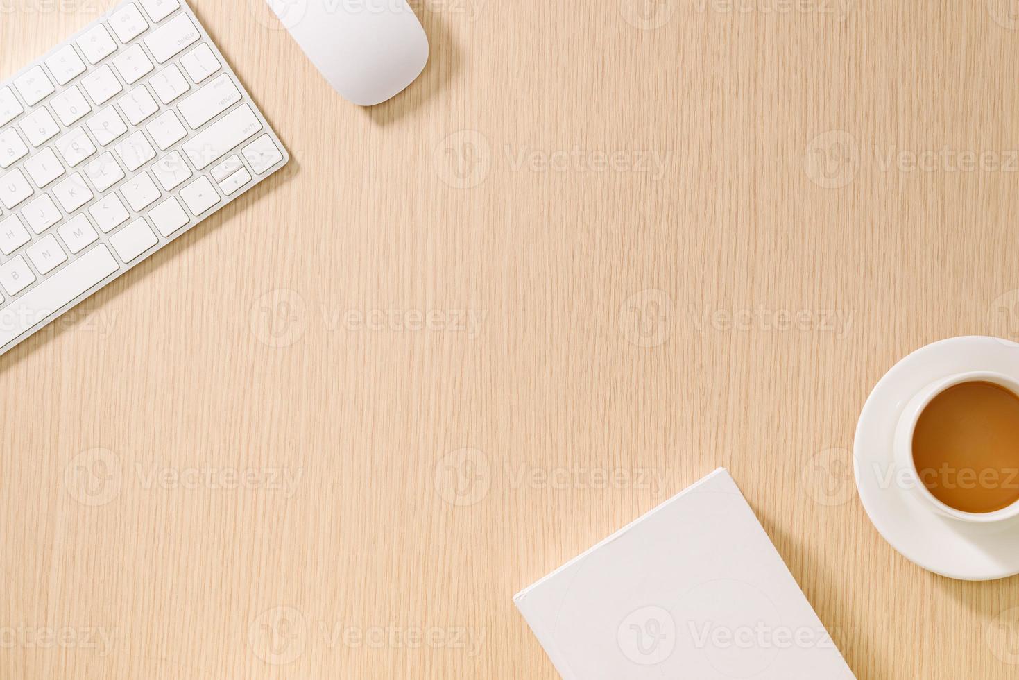 Flat lay, top view office table desk. Workspace with blank note book, keyboard, office supplies and coffee cup on wooden background. photo