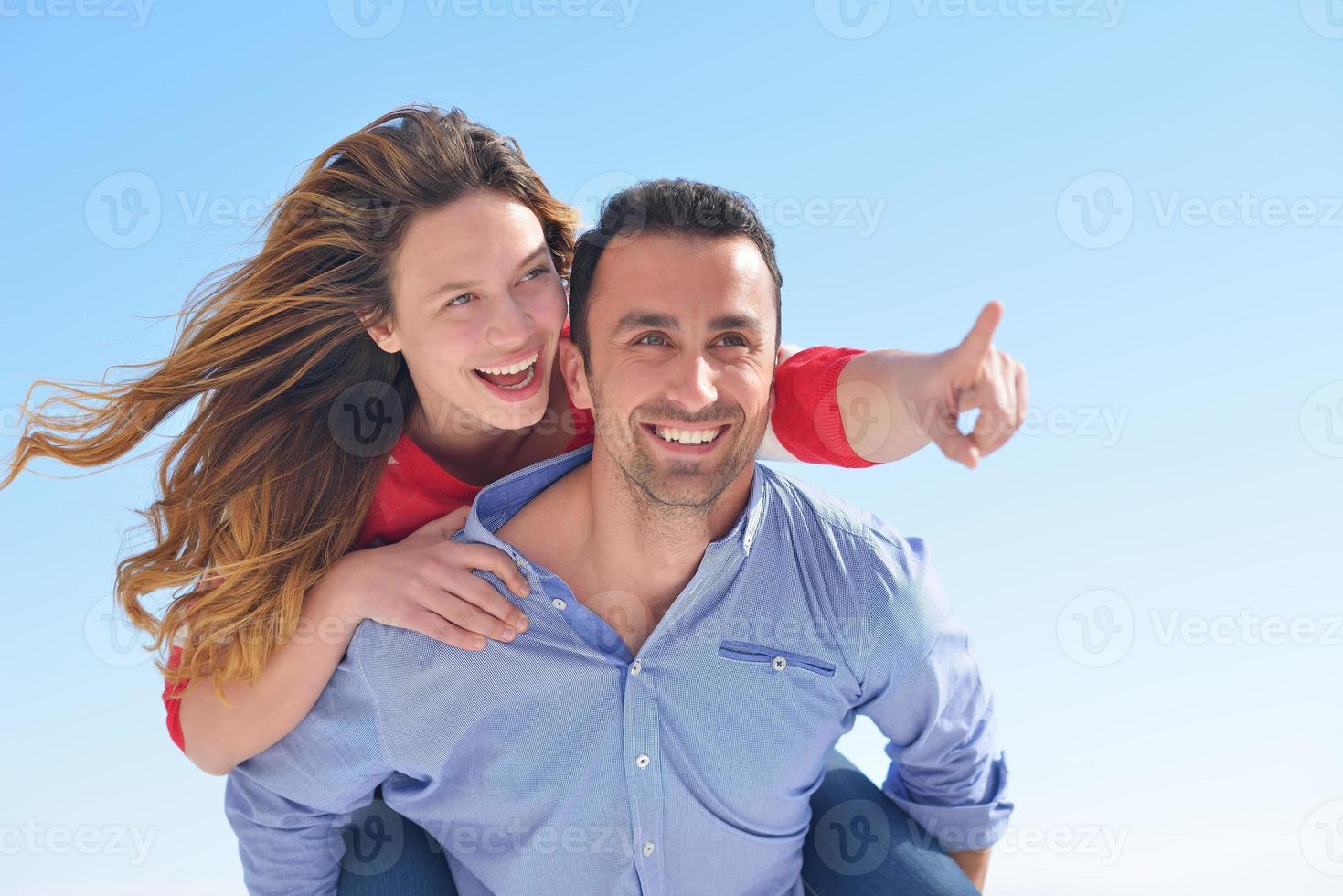 happy young romantic couple have fun relax photo