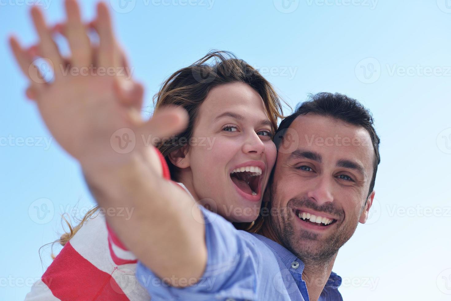 happy young romantic couple have fun relax photo