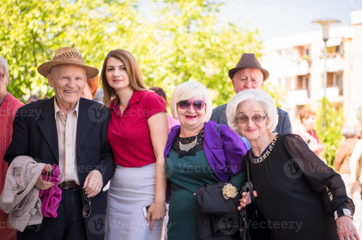 group portrait of senior people with geriatric nurse photo