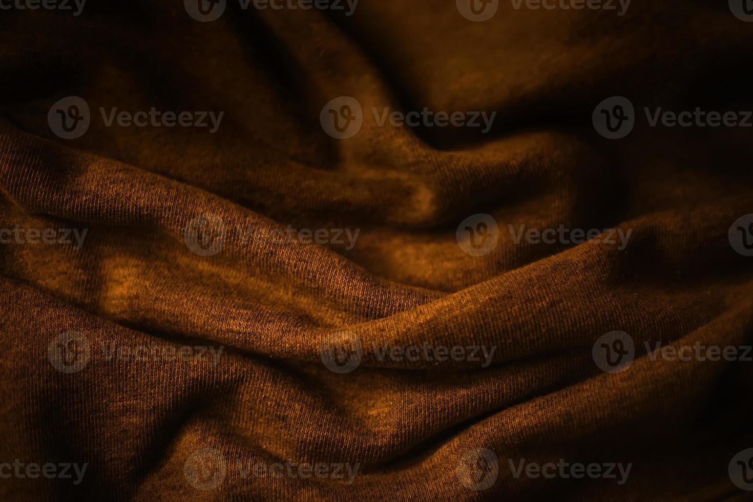 elegant premium gold cloth texture with black background photo