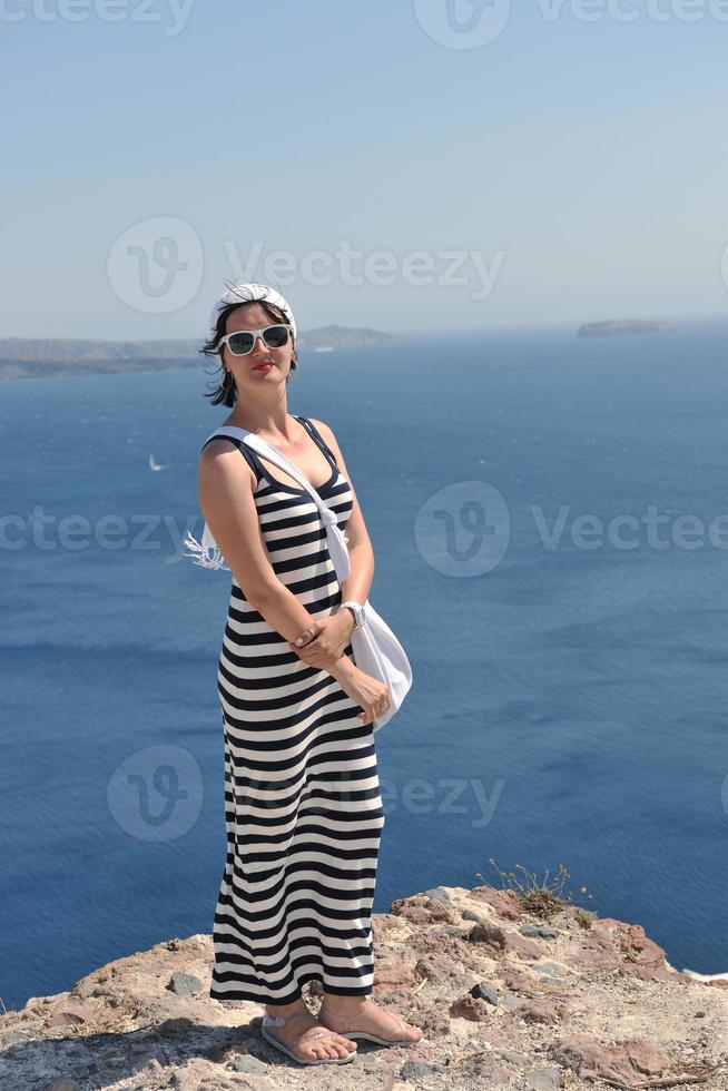 Greek woman on the streets of Oia, Santorini, Greece photo