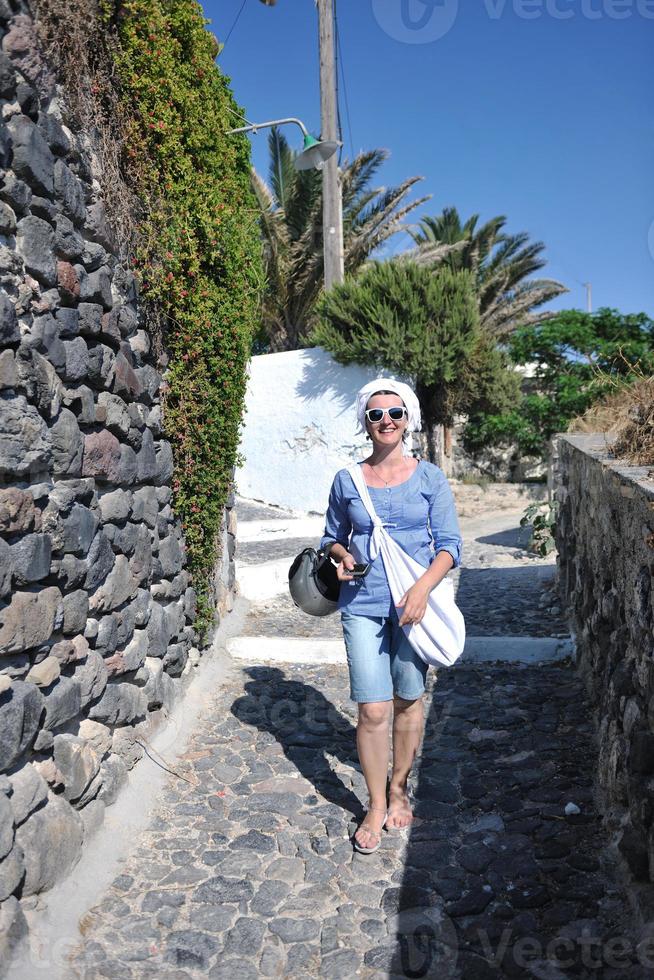 Greek woman on the streets of Oia, Santorini, Greece photo