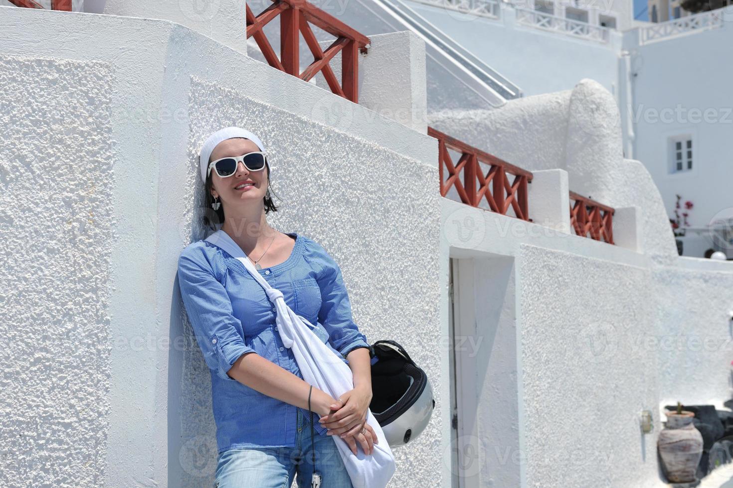 Greek woman on the streets of Oia, Santorini, Greece photo