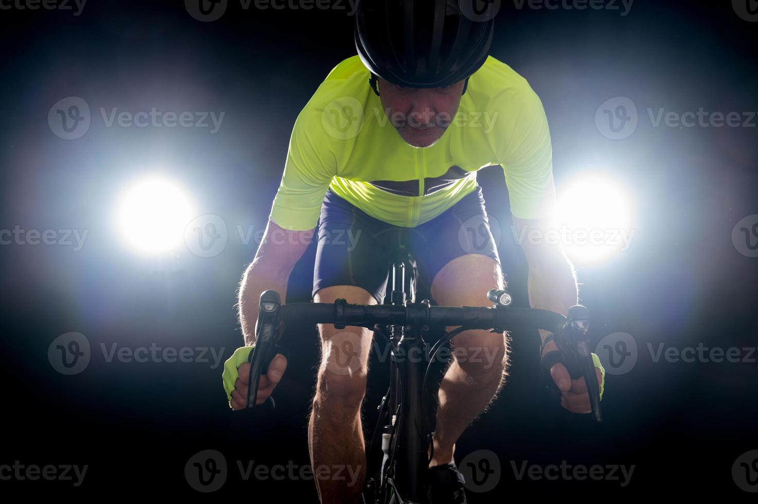 Dramatically backlit cyclist photo