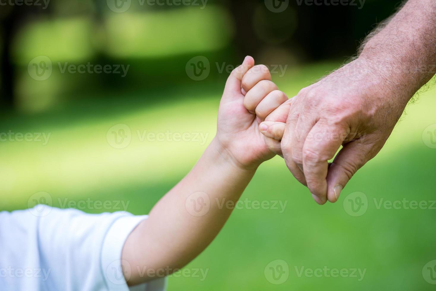 grandfather and child have fun  in park photo