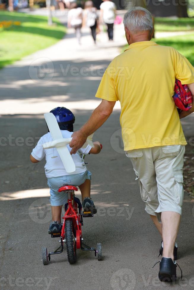 happy grandfather and child in park photo