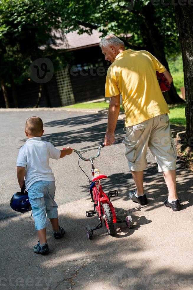 grandfather and child have fun  in park photo