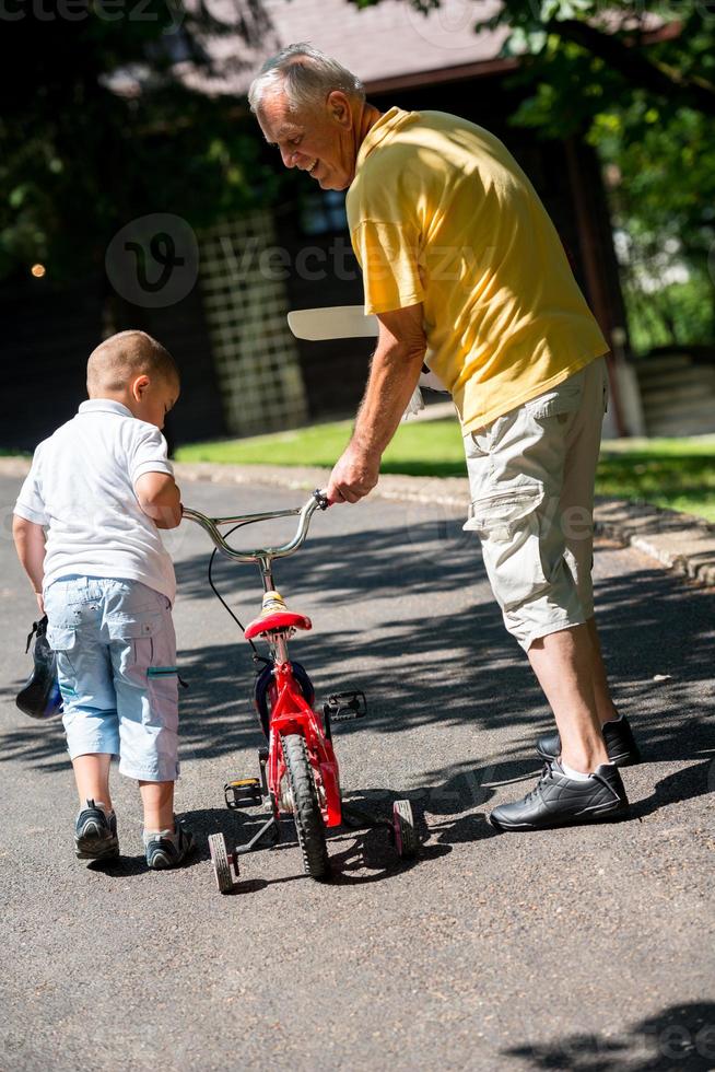 grandfather and child have fun  in park photo