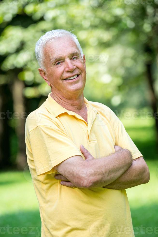 Portrait of smiling elderly man photo