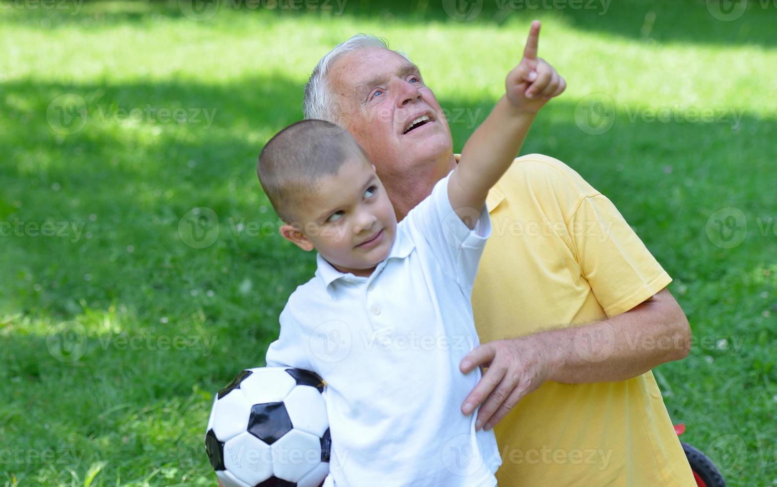 happy grandfather and child in park photo