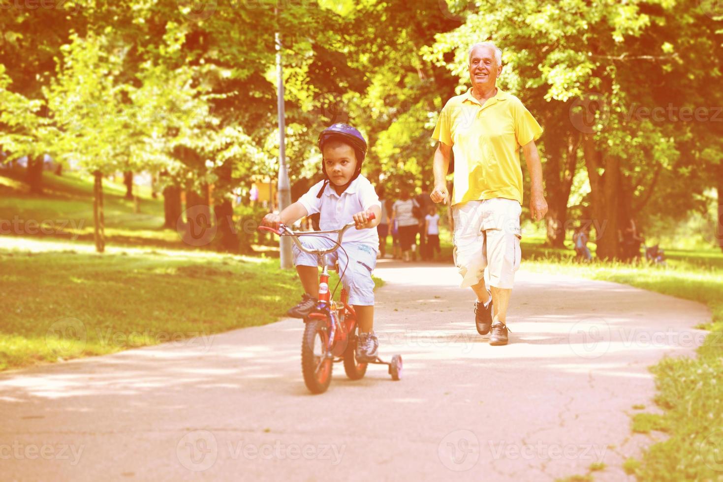 happy grandfather and child in park photo