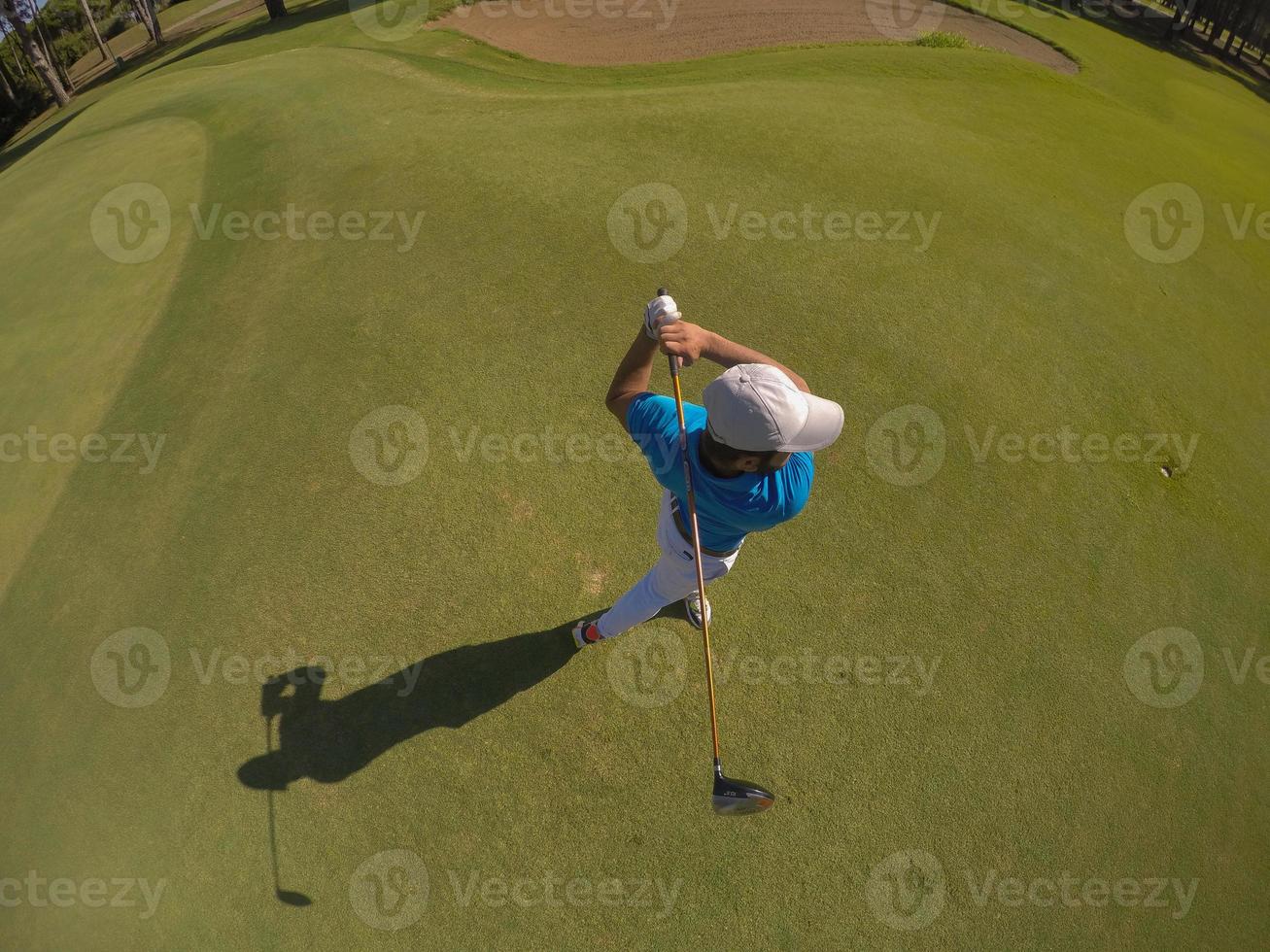 top view of golf player hitting shot photo