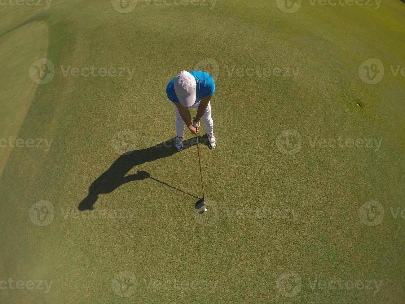 top view of golf player hitting shot photo