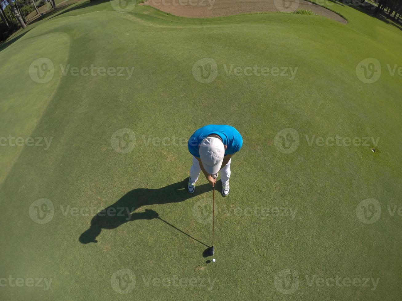 top view of golf player hitting shot photo